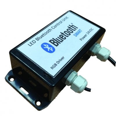 BLUETOOTH RGB Control Unit Small rectangular black LED Bluetooth control unit labeled "LED Bluetooth Control Unit Bluetooth SMART RGB Driver Power: 24VDC" sits mounted with two cable glands and wires on a white background.