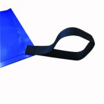 Blue vinyl corner of a tarp sits flat while a black woven strap forms a loop extending from the reinforced corner, photographed against a plain white background.